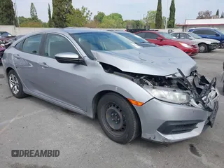 2017 Honda Civic LX with VIN 2HGFC2F5XHH562089, listed as a IAAI auction lot 42010207 with 99,809 mi miles and . Bid and sale history available at DreamBid. Image 13.