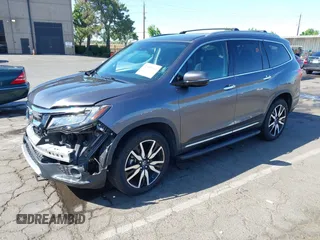 2021 Honda Pilot Touring 8-Passenger with VIN 5FNYF6H97MB034399, listed as a IAAI auction lot 42303419 with 50,034 mi miles and . Bid and sale history available at DreamBid. Image 18.