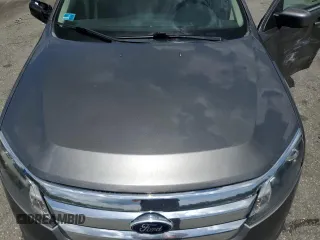 2012 Ford Fusion SE z VIN 3FAHP0HA6CR183815, wystawiony jako Copart lot #58187975 z przebiegiem 118 101 mil mil oraz Szkoda całkowita • Salvage title. Historia ofert i sprzedaży dostępna na DreamBid. Obrazek 11.