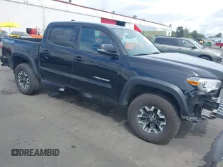2022 Toyota Tacoma SR with VIN 3TMCZ5AN0NM476635, listed as a IAAI auction lot 42229285 with 60,805 mi miles and . Bid and sale history available at DreamBid. Image 1.