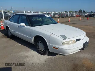 1999 Oldsmobile 88 LS z VIN 1G3HN52KXX4805006, wystawiony jako IAAI lot #42438259 z przebiegiem 127 002 mil mil oraz . Historia ofert i sprzedaży dostępna na DreamBid. Obrazek 1.