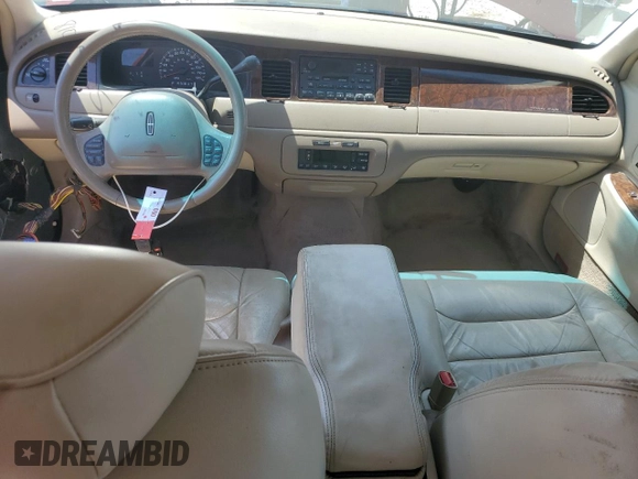 2000 Lincoln Town Car Signature with VIN 1LNHM82W2YY809189, listed as a Copart auction lot 59812665 with 148,236 mi miles and Salvage title. Bid and sale history available at DreamBid. Image 8.
