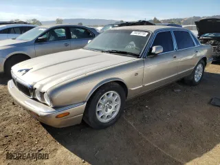 1998 Jaguar XJ with VIN SAJHX1248WC818587, listed as a Copart auction lot 74418114 with 112,395 mi miles and Clean Title. Bid and sale history available at carsss.com. Image 1.