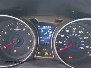 2012 Hyundai Veloster w/Gray Int z VIN KMHTC6AD3CU069427, wystawiony jako IAAI lot #42292476 z przebiegiem 166 960 mil mil oraz . Historia ofert i sprzedaży dostępna na DreamBid. Obrazek 7.