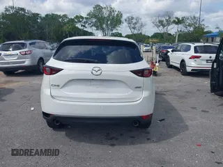 2018 Mazda CX-5 Touring z VIN JM3KFACM6J1419663, wystawiony jako IAAI lot #41879677 z przebiegiem 115 224 mil mil oraz . Historia ofert i sprzedaży dostępna na DreamBid. Obrazek 16.