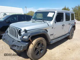 2023 Jeep Wrangler Sport z VIN 1C4HJXDG0PW582947, wystawiony jako IAAI lot #41932930 z przebiegiem 19 670 mil mil oraz . Historia ofert i sprzedaży dostępna na DreamBid. Obrazek 2.