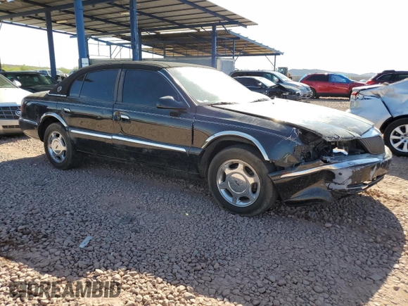 2001 Lincoln Continental with VIN 1LNHM97V61Y604213, listed as a Copart auction lot 52517535 with 112,391 mi miles and Salvage Title. Bid and sale history available at DreamBid. Image 4.