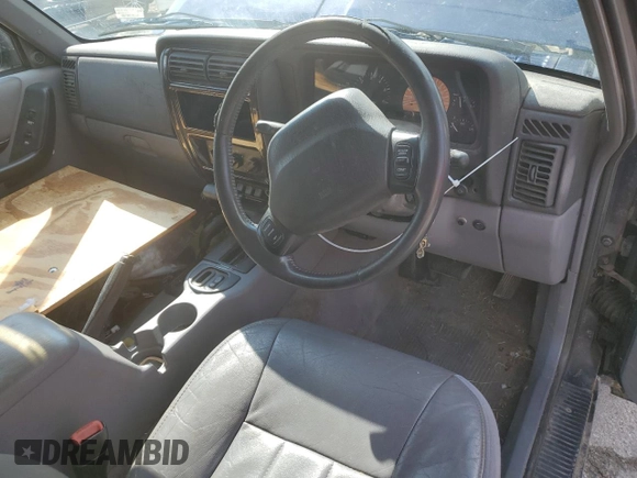 1997 Jeep Cherokee with VIN 1J4FN78S6VL604971, listed as a Copart auction lot 70690304 with 226,913 mi miles and Salvage title. Bid and sale history available at DreamBid. Image 8.