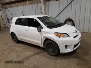 2014 Scion xD with VIN JTKKUPB48E1046627, listed as a Copart auction lot 61498995 with 63,452 mi miles and Salvage title. Bid and sale history available at DreamBid. Image 4.