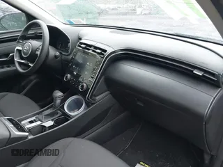 2022 Hyundai Tucson SEL z VIN 5NMJBCAE9NH015906, wystawiony jako IAAI lot #42169136 z przebiegiem 28 009 mil mil oraz . Historia ofert i sprzedaży dostępna na DreamBid. Obrazek 5.