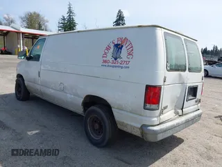 2000 Ford Econoline Cargo with VIN 1FTRE14W7YHA37668, listed as a IAAI auction lot 42001679 with 210,713 mi miles. Bid and sale history available at carsss.com. Image 3.