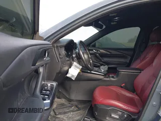 2021 Mazda CX-9 Grand Touring with VIN JM3TCADY1M0519288, listed as a IAAI auction lot 41186094 with 50,701 mi miles and . Bid and sale history available at DreamBid. Image 5.