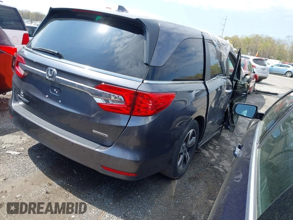 2018 Honda Odyssey Touring with VIN 5FNRL6H8XJB029570, listed as a IAAI auction lot 41485794 with 77,601 mi miles. Bid and sale history available at carsss.com. Image 4.