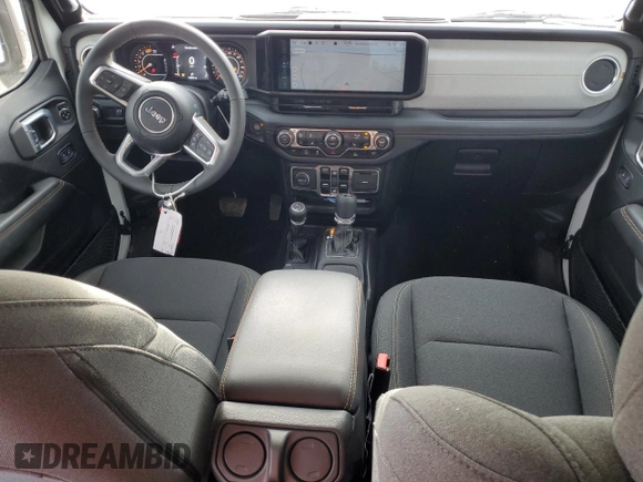 2024 Jeep Wrangler Sahara z VIN 1C4PJXEG8RW264328, wystawiony jako Copart lot #57106615 z przebiegiem 14 890 mil mil oraz Szkoda całkowita • Salvage title. Historia ofert i sprzedaży dostępna na DreamBid. Obrazek 8.