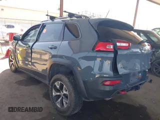 2014 Jeep Cherokee Trailhawk with VIN 1C4PJMBS5EW134900, listed as a IAAI auction lot 41997316 with 96,445 mi miles. Bid and sale history available at carsss.com. Image 3.