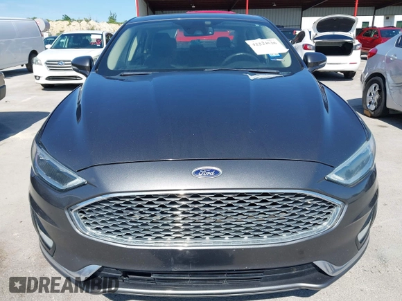 2019 Ford Fusion Titanium with VIN 3FA6P0D91KR104827, listed as a IAAI auction lot 42221526 with 141,316 mi miles and . Bid and sale history available at DreamBid. Image 12.