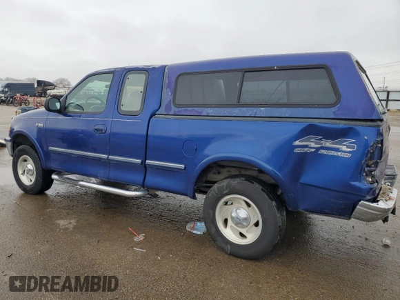 1997 Ford F-150 XL with VIN 1FTDX18W3VKC25911, listed as a Copart auction lot 44074305 with 184,409 mi miles and Salvage Title. Bid and sale history available at carsss.com. Image 2.