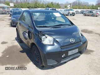 2012 Scion iQ with VIN JTNJJXB03CJ018302, listed as a IAAI auction lot 42000097 with 191,918 mi miles. Bid and sale history available at carsss.com. Image 1.