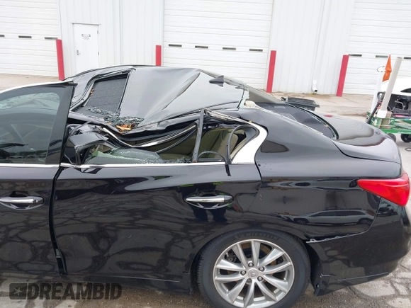2015 Infiniti Q50 Premium with VIN JN1BV7AR8FM396828, listed as a IAAI auction lot 42313019 with 130,707 mi miles and . Bid and sale history available at DreamBid. Image 6.