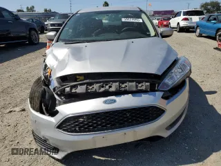 2018 Ford Focus SE with VIN 1FADP3F25JL324753, listed as a Copart auction lot 58624995 with 129,127 mi miles and Salvage title. Bid and sale history available at DreamBid. Image 5.