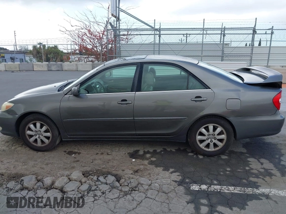 2004 Toyota Camry LE with VIN 4T1BF32K84U588764, listed as a IAAI auction lot 42126345 with 144,642 mi miles. Bid and sale history available at carsss.com. Image 14.