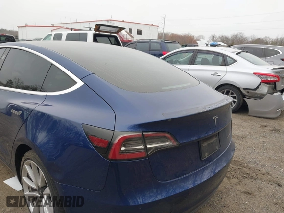 2019 Tesla Model 3 Long Range with VIN 5YJ3E1EB9KF454007, listed as a IAAI auction lot 41769346 with 141,609 mi miles. Bid and sale history available at carsss.com. Image 6.