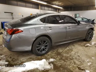 2015 Infiniti Q70 z VIN JN1BY1AR1FM560117, wystawiony jako Copart lot #81796594 z przebiegiem 87 093 mil mil oraz Szkody całkowita. Historia ofert i sprzedaży dostępna na DreamBid. Obrazek 3.