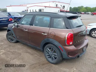 2014 MINI Countryman S z VIN WMWZC5C5XEWP38408, wystawiony jako IAAI lot #42360746 z przebiegiem 136 266 mil mil oraz . Historia ofert i sprzedaży dostępna na DreamBid. Obrazek 3.