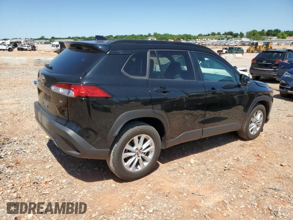 2023 Toyota Corolla Cross LE with VIN 7MUCAAAG3PV058094, listed as a Copart auction lot 57983105 with 30,593 mi miles and Salvage title. Bid and sale history available at DreamBid. Image 3.