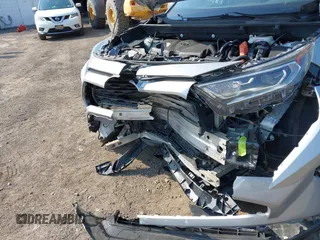 2020 Toyota RAV4 Hybrid XLE z VIN 2T3RWRFVXLW054810, wystawiony jako IAAI lot #42411211 z przebiegiem 94 523 mil mil oraz . Historia ofert i sprzedaży dostępna na DreamBid. Obrazek 6.