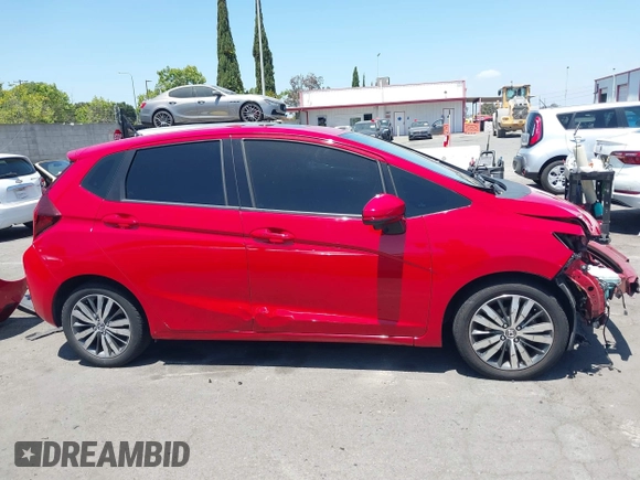 2015 Honda Fit EX-L z VIN 3HGGK5H84FM742893, wystawiony jako IAAI lot #42272487 z przebiegiem 84 942 mil mil oraz . Historia ofert i sprzedaży dostępna na DreamBid. Obrazek 14.