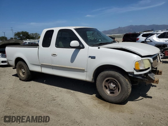 2003 Ford F-150 XL with VIN 2FTRX17213CA05950, listed as a Copart auction lot 54435115 with 310,503 mi miles and Salvage title. Bid and sale history available at DreamBid. Image 4.