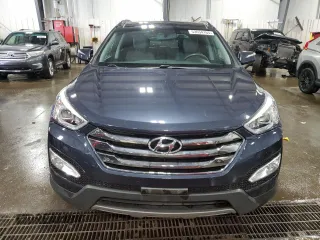 2014 Hyundai Santa Fe z VIN 5XYZUDLB0EG200376, wystawiony jako Copart lot #53634165 z przebiegiem 64 561 mil mil oraz Szkoda całkowita • Salvage title. Historia ofert i sprzedaży dostępna na DreamBid. Obrazek 5.