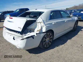 2013 Chrysler 300 with VIN 2C3CCABGXDH699096, listed as a IAAI auction lot 41614034 with 136,344 mi miles. Bid and sale history available at carsss.com. Image 4.
