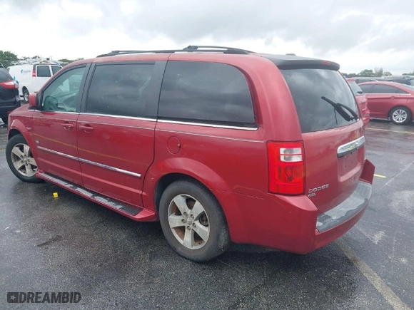 2009 Dodge Grand Caravan SXT with VIN 2D8HN54X49R641293, listed as a IAAI auction lot 41988765 with 106,734 mi miles. Bid and sale history available at carsss.com. Image 3.