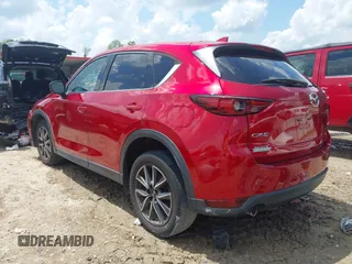 2018 Mazda CX-5 Grand Touring with VIN JM3KFADM4J0335913, listed as a IAAI auction lot 42326044 with 104,583 mi miles and . Bid and sale history available at DreamBid. Image 3.