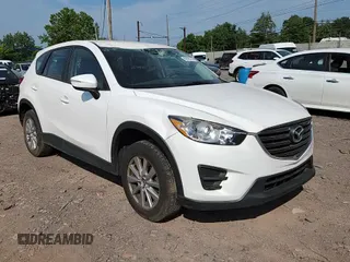 2016 Mazda CX-5 Sport with VIN JM3KE4BYXG0704194, listed as a Copart auction lot 62095735 with 93,970 mi miles and Salvage title. Bid and sale history available at DreamBid. Image 14.