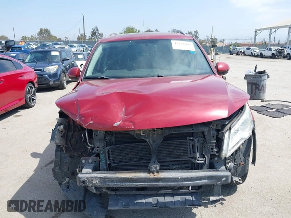 2010 Volkswagen Tiguan S z VIN WVGAV7AX3AW001762, wystawiony jako IAAI lot #42572895 z przebiegiem 127 433 mil mil oraz . Historia ofert i sprzedaży dostępna na DreamBid. Obrazek 13.