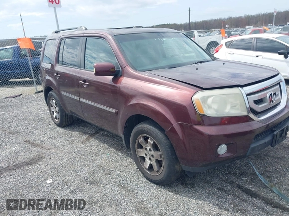 2010 Honda Pilot Touring with VIN 5FNYF4H95AB040721, listed as a IAAI auction lot 41928412 with 213,219 mi miles and . Bid and sale history available at carsss.com. Image 1.