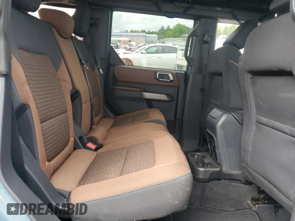 2023 Ford Bronco z VIN 1FMEE5DP9PLB17477, wystawiony jako Copart lot #58829615 z przebiegiem 22 069 mil mil oraz Szkoda całkowita • Salvage title. Historia ofert i sprzedaży dostępna na DreamBid. Obrazek 11.