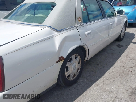 2003 Cadillac DeVille z VIN 1G6KD54Y23U221187, wystawiony jako IAAI lot #42339315 z przebiegiem 82 681 mil mil oraz . Historia ofert i sprzedaży dostępna na DreamBid. Obrazek 6.