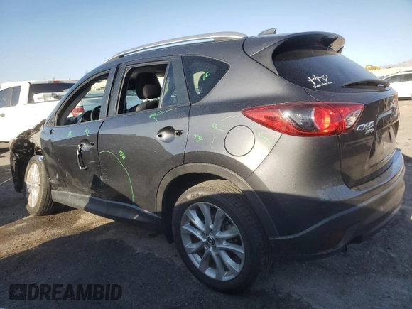 2014 Mazda CX-5 Grand Touring with VIN JM3KE4DY1E0328852, listed as a Copart auction lot 53965265 with 67,242 mi miles and Salvage Title. Bid and sale history available at DreamBid. Image 2.
