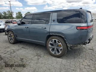 2022 Rivian R1S Launch Edition z VIN 7PDSGABL5NN001018, wystawiony jako Copart lot #56914725 z przebiegiem 26 156 mil mil oraz Szkoda całkowita • Salvage title. Historia ofert i sprzedaży dostępna na DreamBid. Obrazek 2.