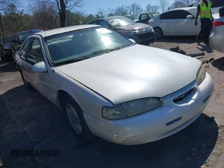 1996 Ford Thunderbird LX with VIN 1FALP62W8TH128351, listed as a IAAI auction lot 41730676 with 166,550 mi miles. Bid and sale history available at carsss.com. Image 1.
