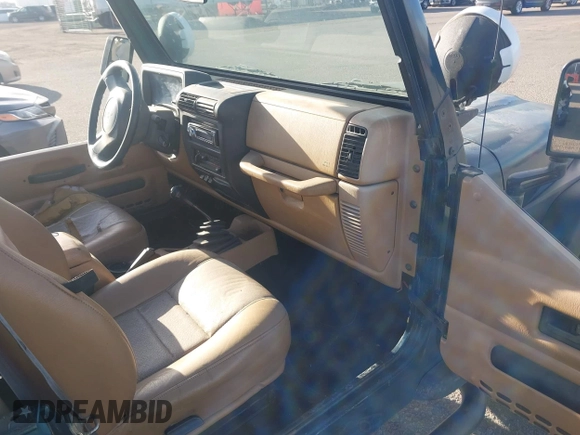 1997 Jeep Wrangler SE with VIN 1J4FY29PXVP409498, listed as a IAAI auction lot 41818698 with 150,086 mi miles. Bid and sale history available at carsss.com. Image 5.