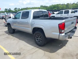 2023 Toyota Tacoma SR with VIN 3TYCZ5AN4PT149730, listed as a IAAI auction lot 42083146 with 31,731 mi miles and . Bid and sale history available at DreamBid. Image 3.