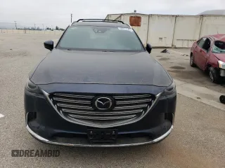 2017 Mazda CX-9 Grand Touring z VIN JM3TCADY3H0140573, wystawiony jako Copart lot #60513145 z przebiegiem 97 793 mil mil oraz Czysty tytuł • Clean title. Historia ofert i sprzedaży dostępna na DreamBid. Obrazek 5.