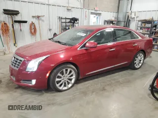 2015 Cadillac XTS Luxury z VIN 2G61M5S39F9189133, wystawiony jako Copart lot #56889185 z przebiegiem 130 927 mil mil oraz Czysty tytuł • Clean title. Historia ofert i sprzedaży dostępna na DreamBid. Obrazek 1.
