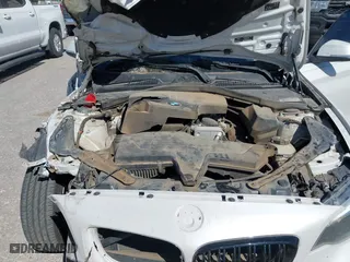 2015 BMW 2 Series 228i with VIN WBA1K5C50FV474011, listed as a IAAI auction lot 41805879 with 83,489 mi miles. Bid and sale history available at carsss.com. Image 9.