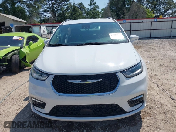 2022 Chrysler Pacifica Touring L with VIN 2C4RC1BG4NR191644, listed as a IAAI auction lot 41979011 with 84,789 mi miles and . Bid and sale history available at DreamBid. Image 12.